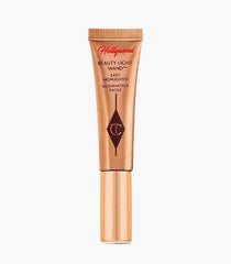 Tilbury Spotlight, Beauty Light Wand 5ml, Charlotte Tilbury Highlighter, liquid glow highlighter, easy highlighter wand, champagne highlighter, dewy skin makeup, radiant glow makeup, Charlotte Tilbury makeup, Hollywood glow highlighter, luxury liquid highlighter - Makeupstashpk