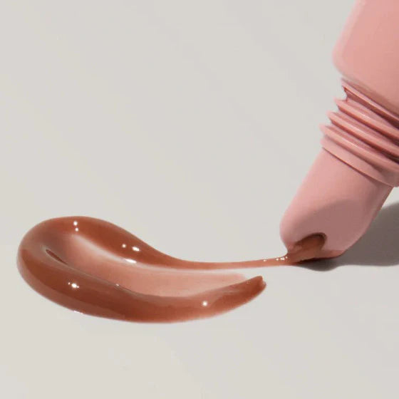 Rhode lip tint, Rhode peptide lip tint toast, hydrating lip tint, glossy nude lip tint, peptide lip treatment, Rhode beauty products, tinted lip balm, moisturizing lip gloss, nude brown lip tint, non sticky lip gloss, lip care treatment, glossy lip tint, everyday lip tint, peptide lip balm, Rhode toast shade - Makeupstashpk